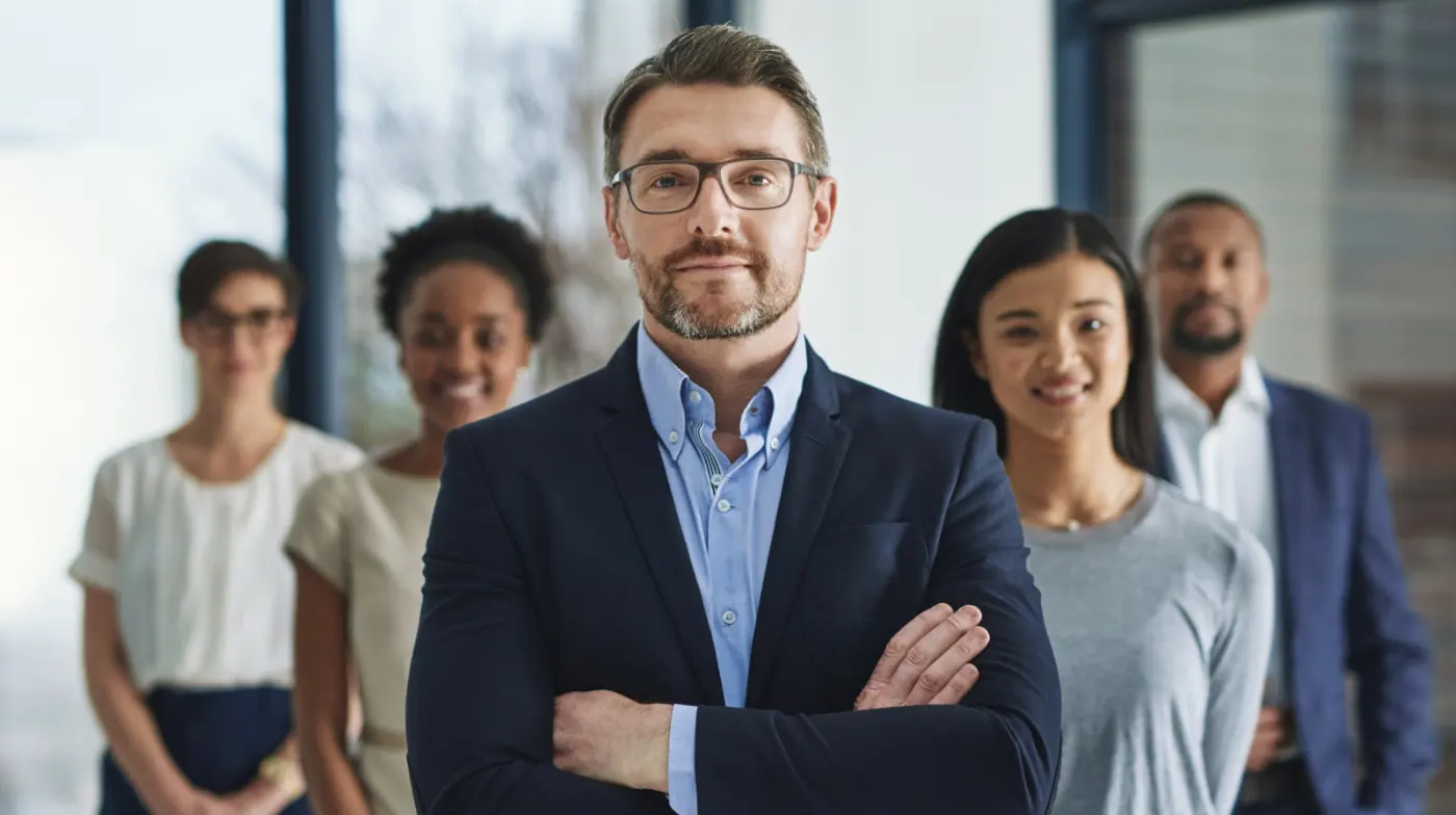 A picture of a leader and his team.