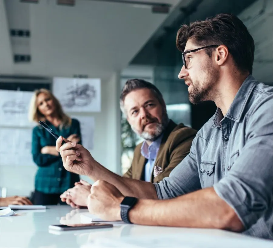 A man shares his thoughts in a meeting.