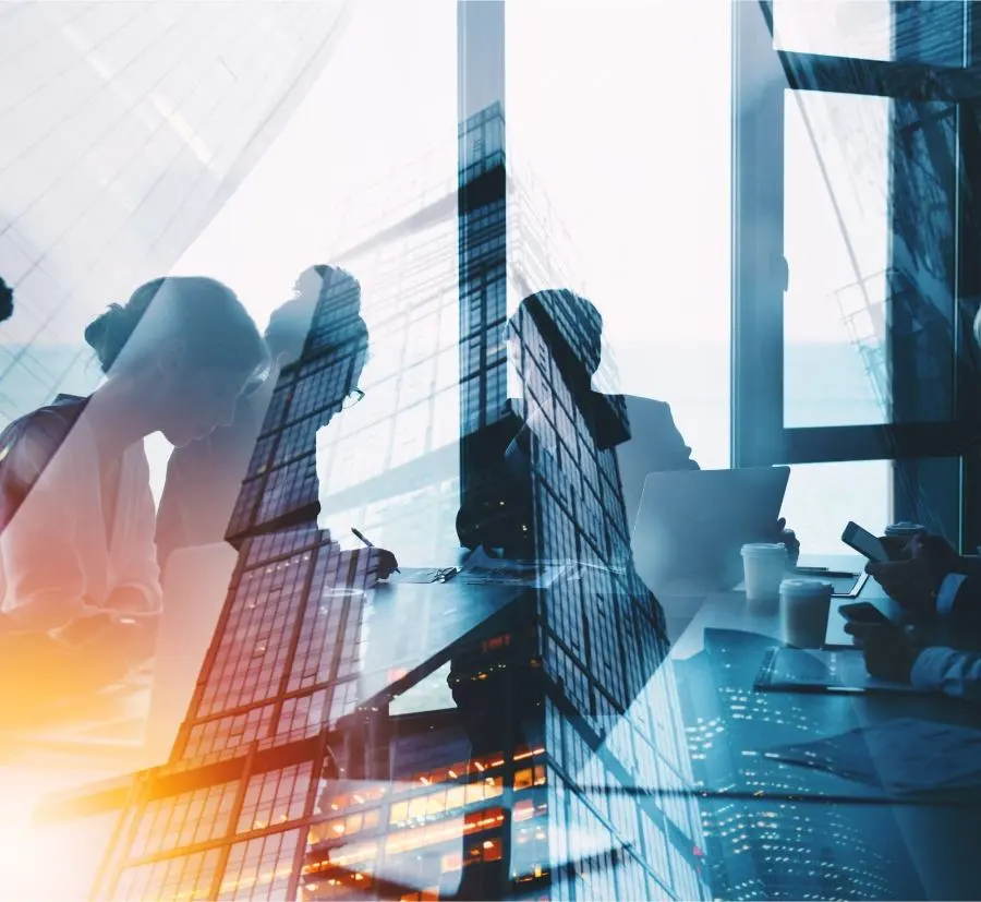 Dynamic image of business people at work in the office with a view of skyscrapers.